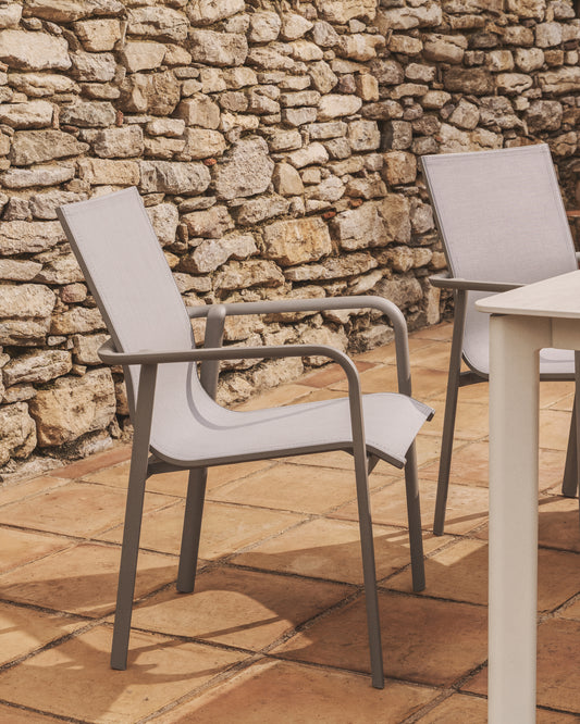 Outdoor stacking chair Canea made of texteline fabric in beige color and aluminum in topo color