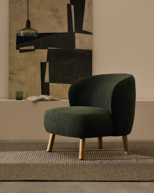 Molded armchair in green chenille with solid beech wood legs in a natural finish