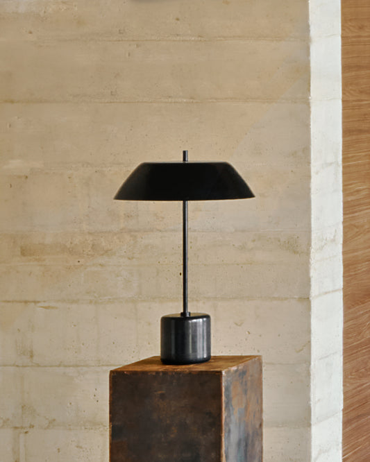 Sayra table lamp made of black marble and metal in black color