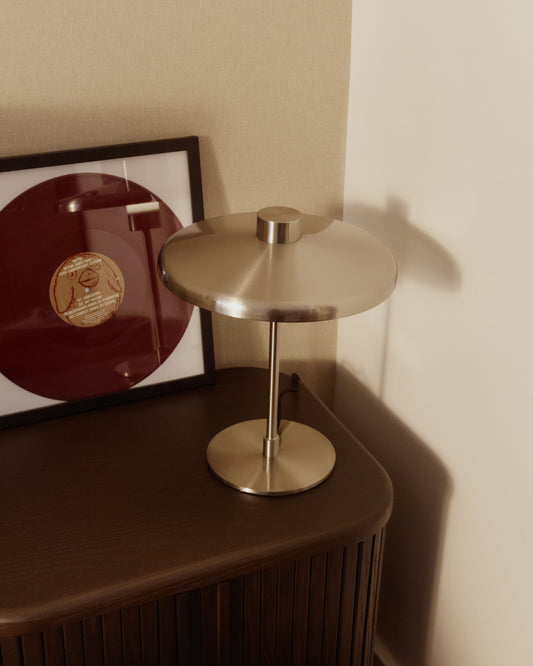 Nuvira table lamp with a light gray brushed metal base