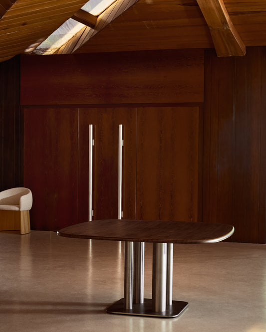 Melvar table in walnut veneer with brushed stainless steel legs 150 x 150cm