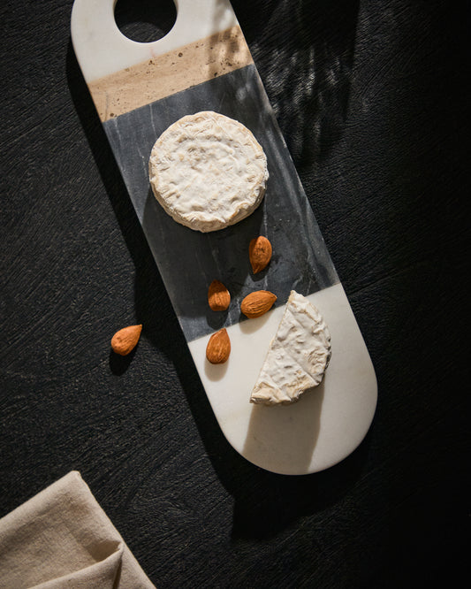 Nivol small serving board made of black and white marble and travertine