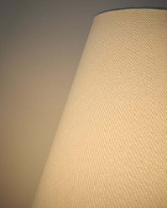 Navat floor lamp made of metal, with a brushed silver finish.